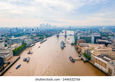 Arial View Of London With The River Thames Floating Through The City Near The Tower Bridge, London City And Westminster Abbey.