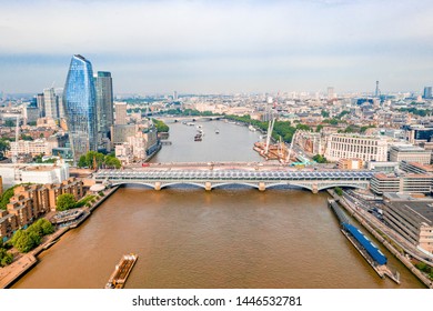 Arial View Of London With The River Thames Floating Through The City Near The Tower Bridge, London City And Westminster Abbey.