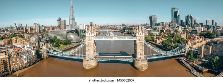 Arial View Of London With The River Thames Floating Through The City Near The Tower Bridge, London City And Westminster Abbey.