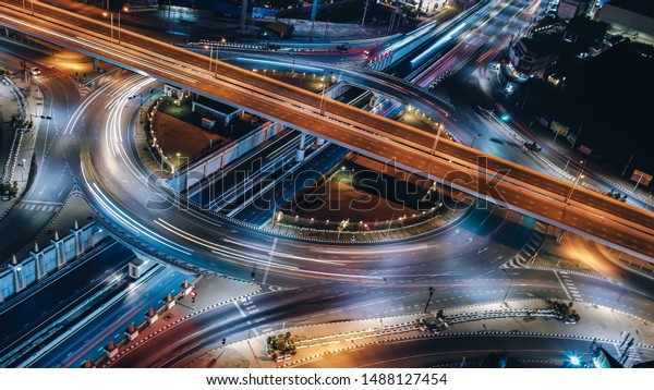 Arial view of Modern smart transportation\
with Expressway, Road and Roundabout, multilevel junction\
highway-Top view. Important\
infrastructure.