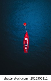 An Arial View Of A Red Row Boat