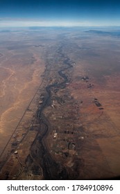 Arial view of river flowing through the desert