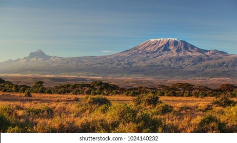 arid dry African savanna in late evening with Mount Kilimanjaro, highest peak i Africa. Amboseli National Park, Kenya