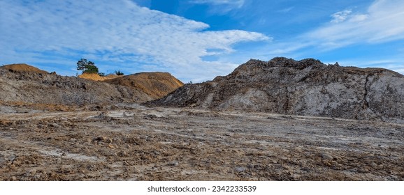 arid land left over from illegal coal mining excavations in Kalimantan, Indonesia