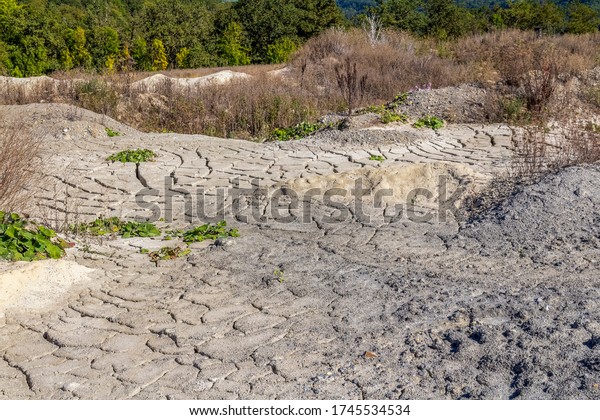 arid\
scenery including lots of fissured dry\
ground