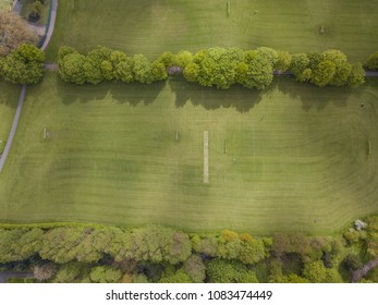 Ariel Drone Above Park Field Green In Residential Area