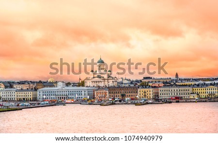 Ariel panoramic view of  Helsinki at sunset with a Cathedral church and  Market Square area on the shore of Baltic Sea in Helsinki, Finland.