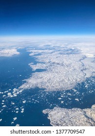 Ariel View Of Greenland Ice Sheet Melting Into Arctic Ocean