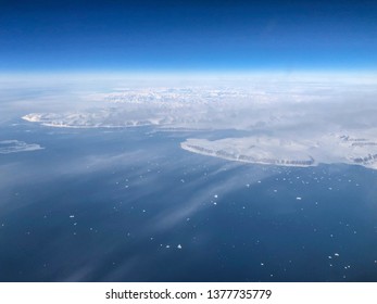 Ariel View Of Greenland Ice Sheet Melting Into Arctic Ocean