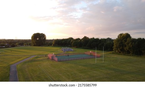 An Ariel View Of A Late Evening Sunset Scene Over Westy Park In Warrington In The UK,taken From Over The Rugby Field Looking Down Towards The Basket Ball Court The By Trees