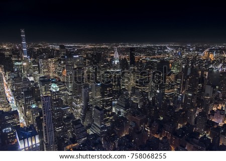 Similar – Skyline of Manhattan at night with skyscrapers lights