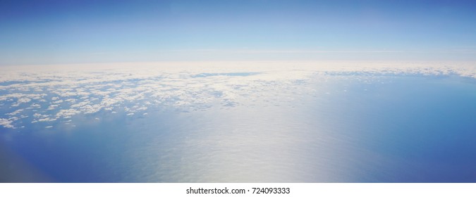 Ariel View Of The Ocean And Clouds From A Plane