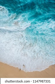 Ariel View On Beach With Waves And People. The Viewpoints At Kelingking Secret Point Beach, Nusa Penida, Indonesia.
(View From The Cliff)