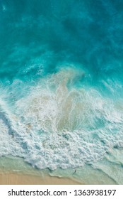 Ariel View On Beach With Waves And People. The Viewpoints At Kelingking Secret Point Beach, Nusa Penida, Indonesia.
(View From The Cliff)