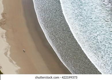 Ariel View On Beach With White Waves And People