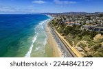 Ariel view of San Clemente Coastline with coastal view homes,  and railroad tracks.