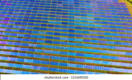 Ariel View , Shot From A Drone On A Farm Field There Are A Lot Of Solar Panels That Produce Environmental Energy. 