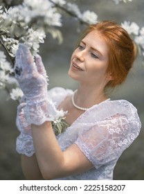 Aristocratic Girl In White Lace Gloves In The Garden