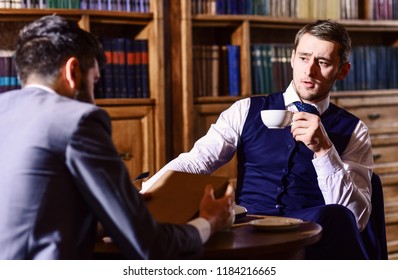 Aristocrats Spend Leisure In Intelligent Company. Tea Party Concept. Oldfashioned Intelligent Men Drink Tea According To British Tradition. Men In Suit Sit In Library Or Retro Interior, Defocused.