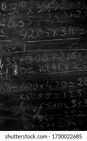 Arithmetic Operations With Rational Numbers, Additions And Subtractions, Handwritten On An Old Chalkboard During The Maths Class. Maths Against Black Chalkboard