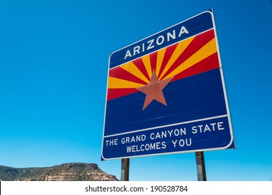 Arizona State Border Highway Sign With A Sky Blue Background