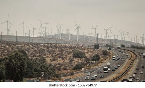 Arizona, US, July 2013 - Huge Quantity Of Wind Turbines Close To A Busy Highway