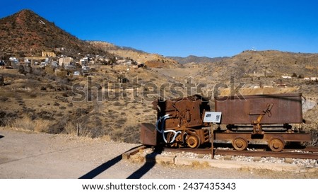 Arizona's ghost town of Jerome, in Yavapai County, with minecarts in front, restaurants, stores, houses, and mines in the background, along J Mountain, near Prescott, Clarkdale, Cottonwood, and Sedona