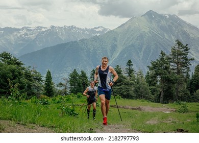 Arkhyz, Russia - July 1, 2022: Two Male Runner Running Uphill Trail In Arkhyz X Run