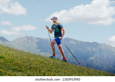 Arkhyz, Russia - July 3, 2022: Male Athlete Walking Uphill Trail In Arkhyz X Run