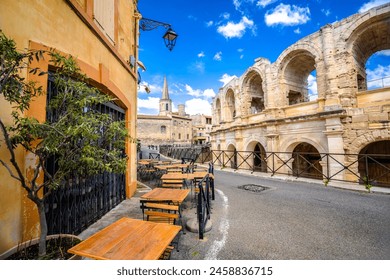 Arles Amphitheatre and colorful street architecture view, South of France - Powered by Shutterstock