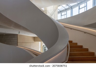 Arles, France-October 2021; Interior view of Luma Arles art center with double circular or helix staircase and exterior with tower building designed by architect Frank Gehry