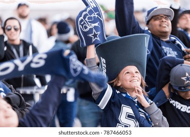 Arlington, Texas / USA - December 19, 2015: Young Dallas Cowboys Fan in a Big Cowboys Hat Outside AT&T Stadium in Arlington, TX