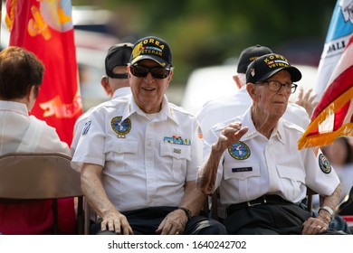 Arlington, Texas, USA - July 4, 2019: Arlington 4th of July Parade, Korean War veterans from the United States Military transported on a float during the parade