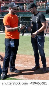 ARLINGTON, TX - APR 18: Recording Artist Luke Bryan (R) And His Tour Manager Mark Sizemore At The ACM & Cabela's Great Outdoor Archery Event At The Texas Rangers Youth On April 18, 2015.