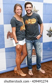 ARLINGTON, TX - APR 18: Singer Thomas Rhett (R) And Wife Lauren Akins Attend The Cracker Barrel Country Checkers Challenge At Globe Life Park In Arlington On April 18, 2015 In Arlington, Texas.