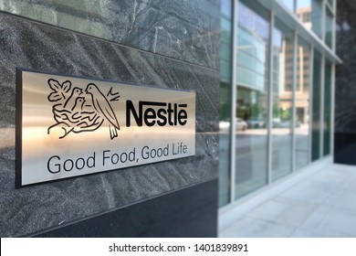 ARLINGTON, VA - MAY 19, 2019: NESTLE USA - Entrance To Headquarters Building With Sign.  Nestlé Is A Swiss Multinational Food Company.