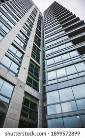 Arlington, VA, USA - 01-05-2021: Vertical Photo Of A Glass Office Building And Its Windows In Arlington, VA. 