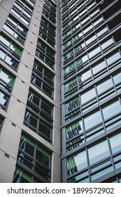 Arlington, VA, USA - 01-05-2021: Vertical Photo Of A Glass Office Building And Its Windows In Arlington, VA. 