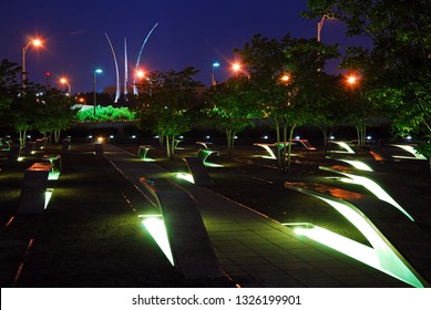 Arlington, VA, USA June 22 The September 11 Memorial Glows On The Pentagon Grounds With The Air Force Memorial Rising Behind It