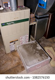 ARLINGTON, VIRGINIA, USA - JULY 2, 2009: Dirty Air Filter On Home Furnace.