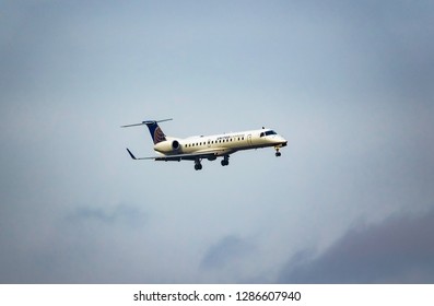 Arlington, Virginia, USA - November, 18, 2018: United Express Airlines Plane (Embraer 145 (ER4, ERJ) Aircraft) In The Sky. 