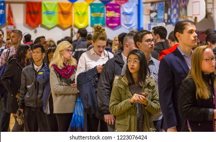 ARLINGTON, VIRGINIA, USA - NOVEMBER 6, 2018: Voters in long queue during midterm voting, at Key School.