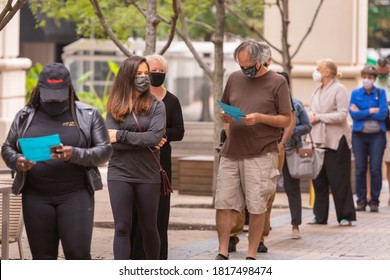 ARLINGTON, VIRGINIA, USA - SEPTEMBER 18, 2020: People Line Up And Look At Sample Ballots During First Day Of Early Voting, 2020 Presidential Election.