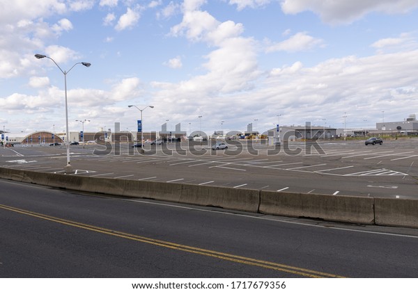 Arlington,\
Virginia/USA- April 28, 2020: A empty parkinglot at Ronnald Regan\
Washington National Airport. during\
Covid-19.