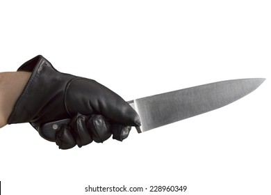 An Arm With Black Leather Gloves Holding A Large Knife