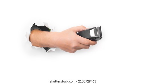 Arm Holding Hairclipper, Isolated On White Background, An Electric Hair Clipper In Hand For Hairdressers, The Barber Clippers Instead Of Scissors