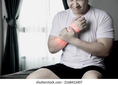 Arm Muscle Pain, Wrist Bone Injury, Muscle Weakness Due To Exercise. Red Inflamed Zone Man With Wrist Pain After Waking Up In Morning