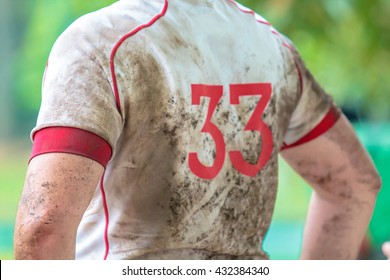 Arm Of Sport Man Football Or Rugby With A Dirty Suit. (This Image Is Focus On Left Arm.)