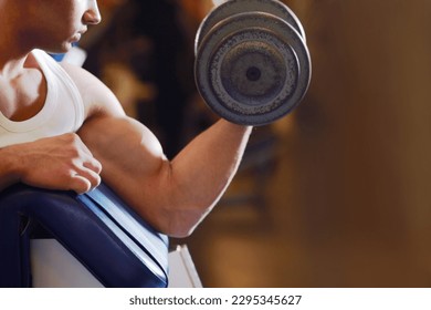 Arm strength, dumbbell and man with training routine, athlete determination or focus on power, health or club challenge. Determined, healthy fitness and ripped person workout for strong bicep growth