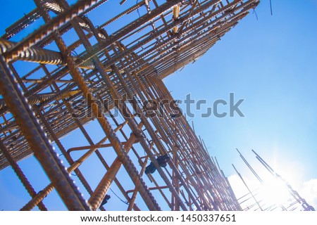 Armature against the blue sky. Metal base of reinforced concrete walls. Part of the structure of the building of reinforced concrete.